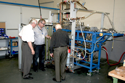 Mr. Milinkovic and his colleagues examining a vapour metallurgy prototype equipment 
